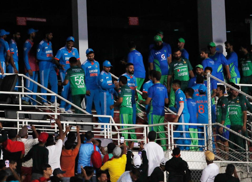 India and Pakistan share spoils in a rain-dampened encounter India and Pakistan share spoils in a rain-dampened encounter